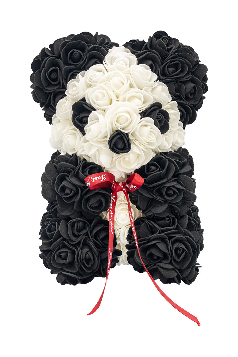 A front view if a panda shaped product covered in foam roses in the color black and white.