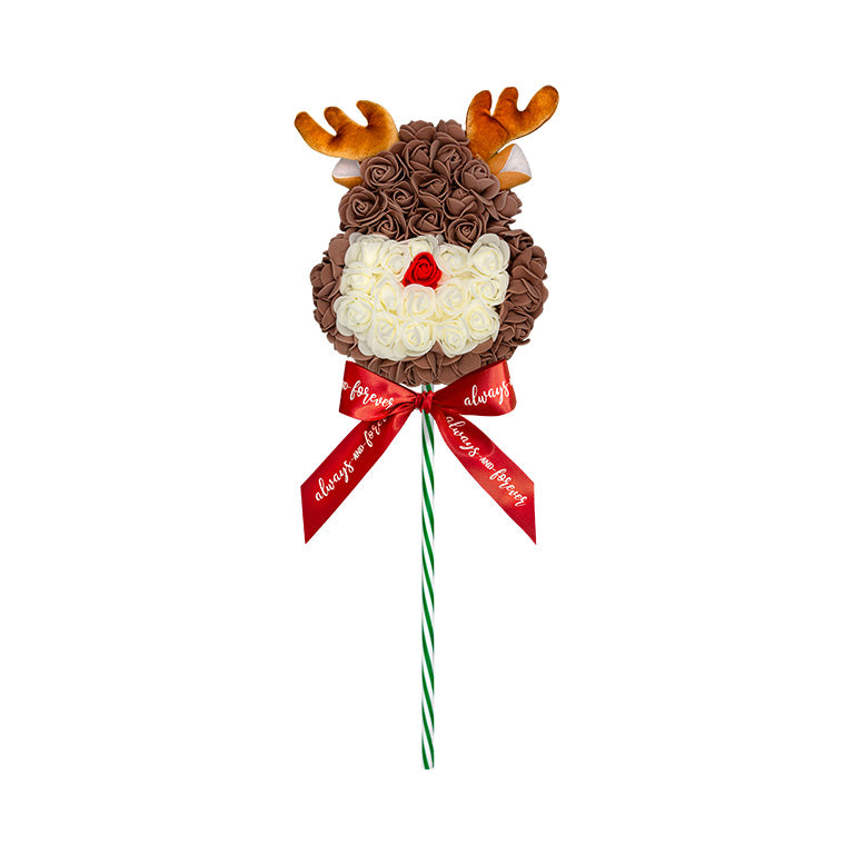 This is a floral arrangement in the shape of a reindeer with brown roses, white facial features, red nose, and antlers, tied with a "Always and forever" ribbon, perfect as a festive gift or decoration.