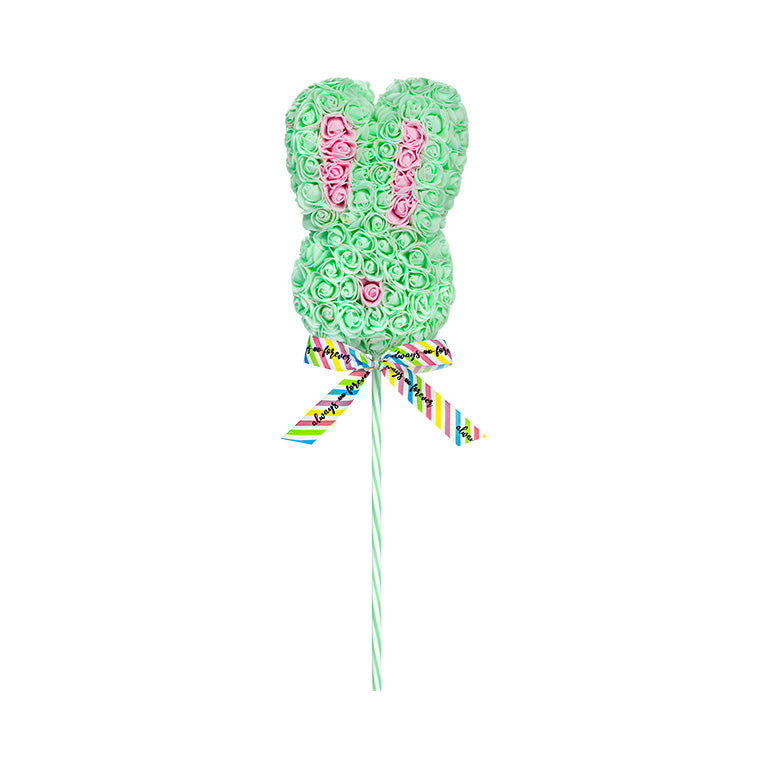 A mint floral bunny lollipop with a patterned ribbon on a striped stick, featuring a playful arrangement of roses in a bunny shape.