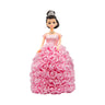 A decorative doll with a handcrafted skirt of pink flowers, a silver tiara and jewelry, evoking a regal look. Ideal for anniversaries, birthdays, graduations, Christmas, Valentine's Day, Quinceañeras, or as a unique collectible gift.