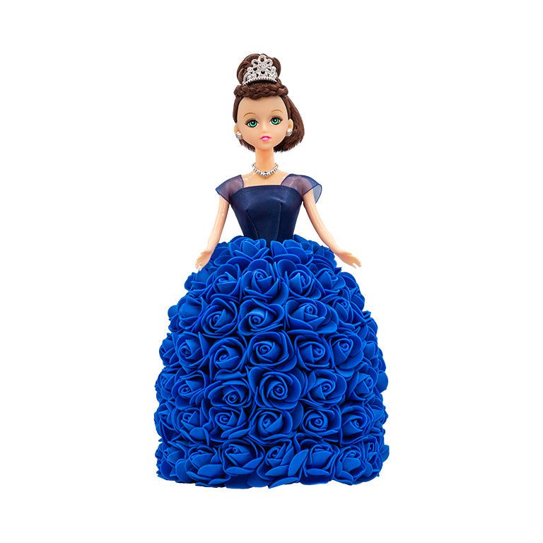 A decorative doll with a handcrafted skirt of blue flowers, a silver tiara and jewelry, evoking a regal look. Ideal for anniversaries, birthdays, graduations, Christmas, Valentine's Day, Quinceañeras, or as a unique collectible gift.