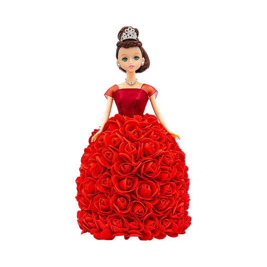 A decorative doll with a handcrafted skirt of red flowers, a silver tiara and jewelry, evoking a regal look. Ideal for anniversaries, birthdays, graduations, Christmas, Valentine's Day, Quinceañeras, or as a unique collectible gift.