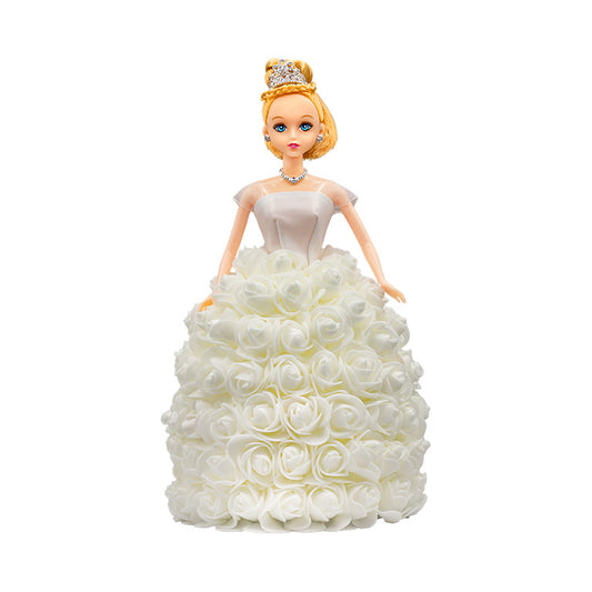 A decorative doll with a handcrafted white of yellow flowers, a silver tiara and jewelry, evoking a regal look. Ideal for anniversaries, birthdays, graduations, Christmas, Valentine's Day, Quinceañeras, or as a unique collectible gift.