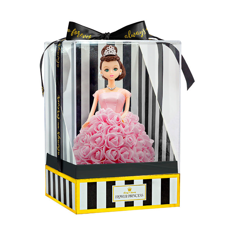 The doll is presented in packaging, which includes a clear plastic cover and a box with black and white stripes, accented with gold trim. The words "Flower Princess" are displayed on the front label. A black ribbon with the text "forever always" is tied in a bow at the top
