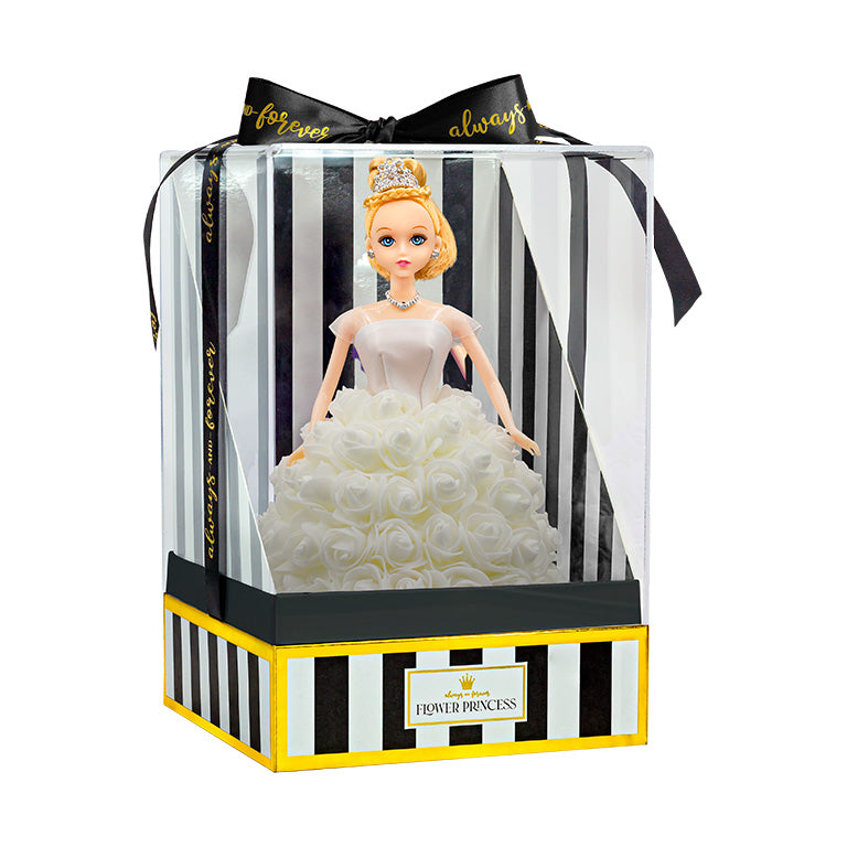 The doll is presented in packaging, which includes a clear plastic cover and a box with black and white stripes, accented with gold trim. The words "Flower Princess" are displayed on the front label. A black ribbon with the text "forever always" is tied in a bow at the top.