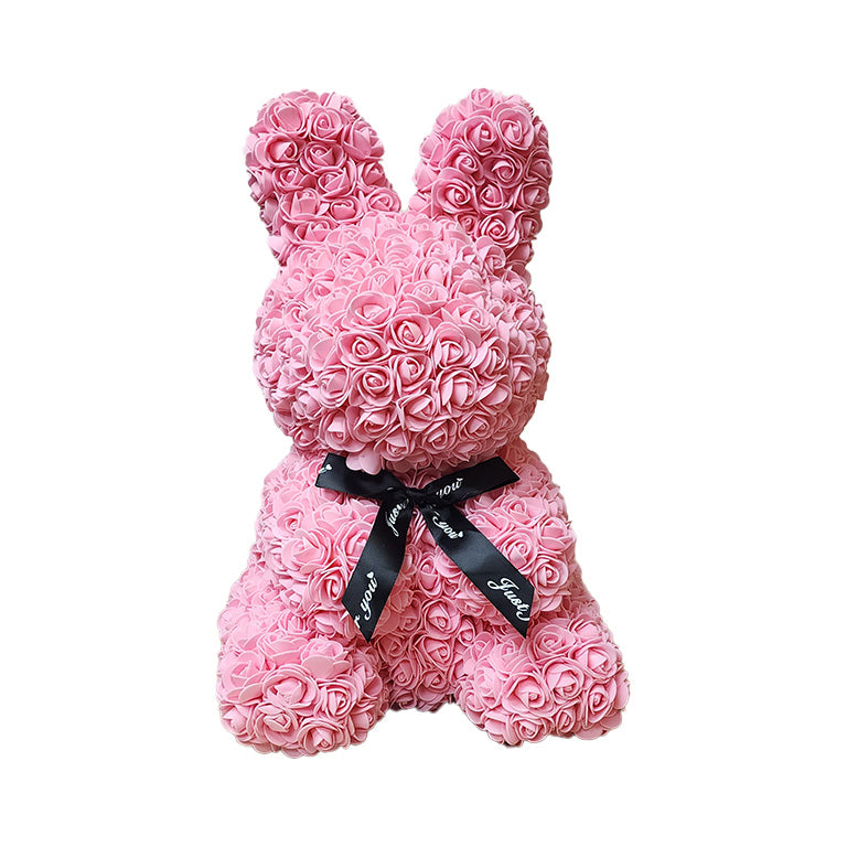 A large flower rabbit covered in pink artificial foam flowers