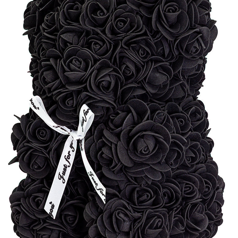 A bear shaped product covered in foam roses in the color black.