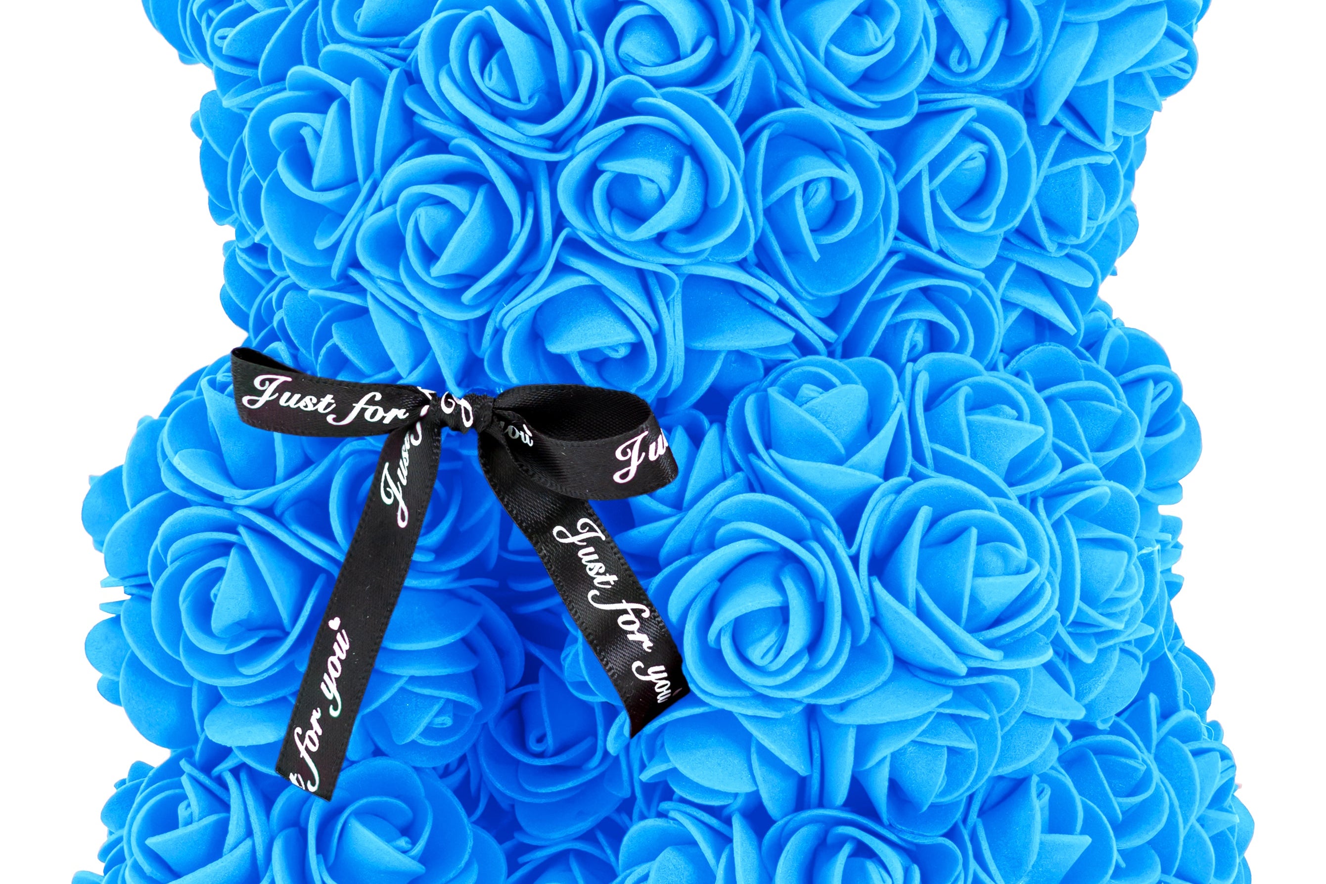 A bear shaped product covered in foam roses in the color blue.