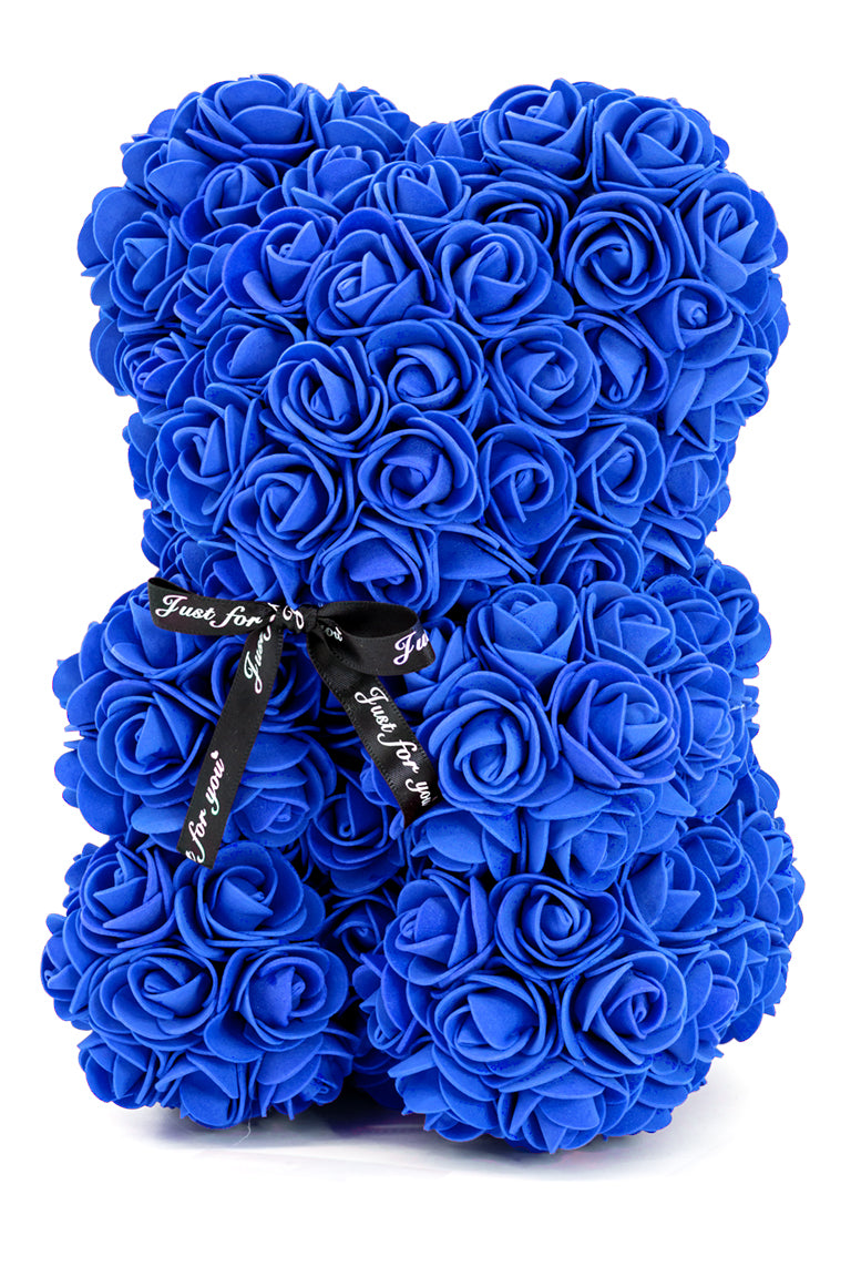 A bear shaped product covered in foam roses in the color navy.