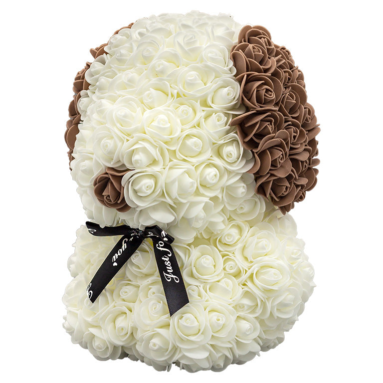 A side view of a puppy shaped product covered in foam roses. The main body is white. The ears and nose are colored brown